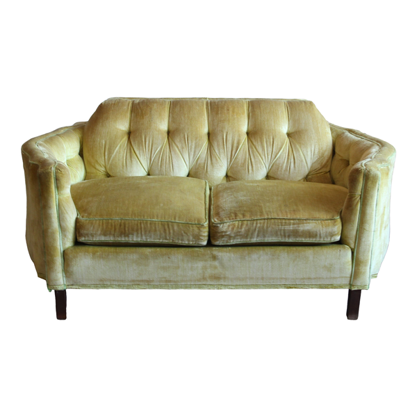 Chartreuse velvet settee with curved arms and tufted back