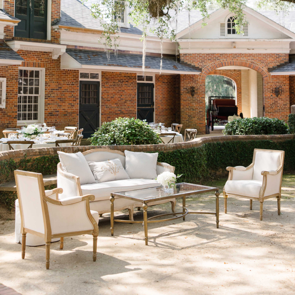 Wedding lounge seating outside at stable courtyard at Pebble Hill Plantation.