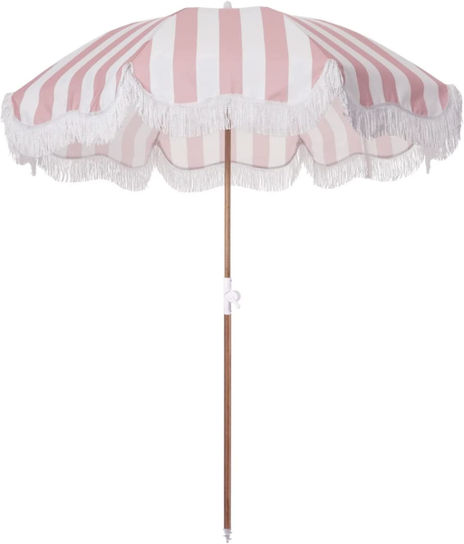 Pink stripe patio umbrella with fringe.
