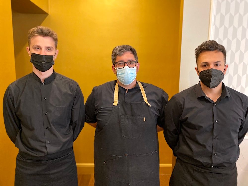 Spanish Chef with 2 waiters after a business meeting