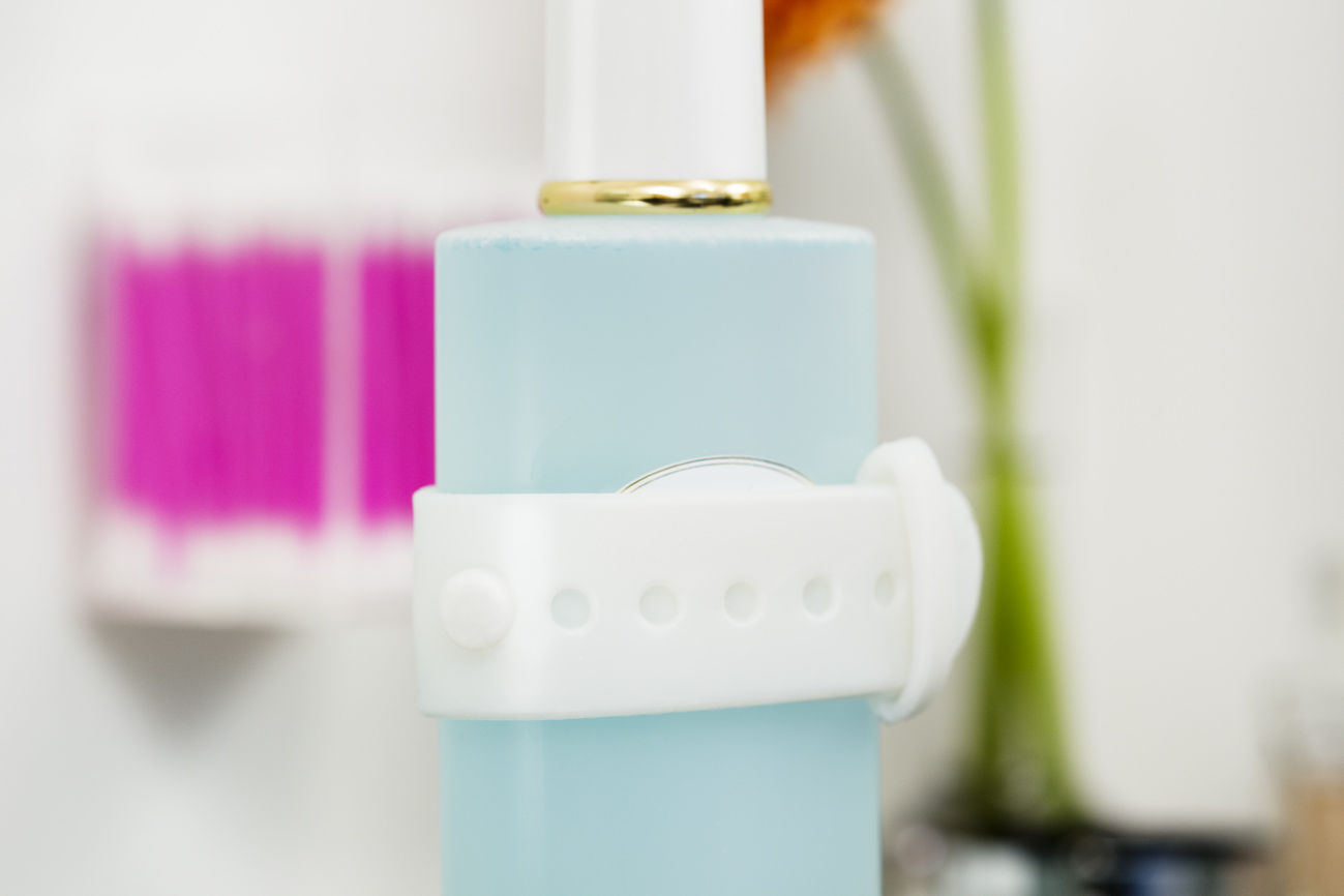 Wrap and hang your shampoo bottle on a Living in a shoebox