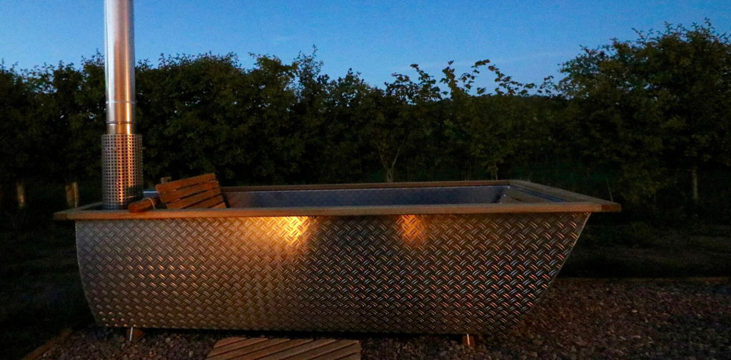 this modern wooden igloo hut boasts a cozy alcove bed and
