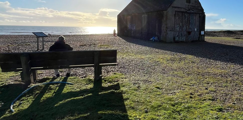 Rye harbours old life boat station with the sun out across the sea