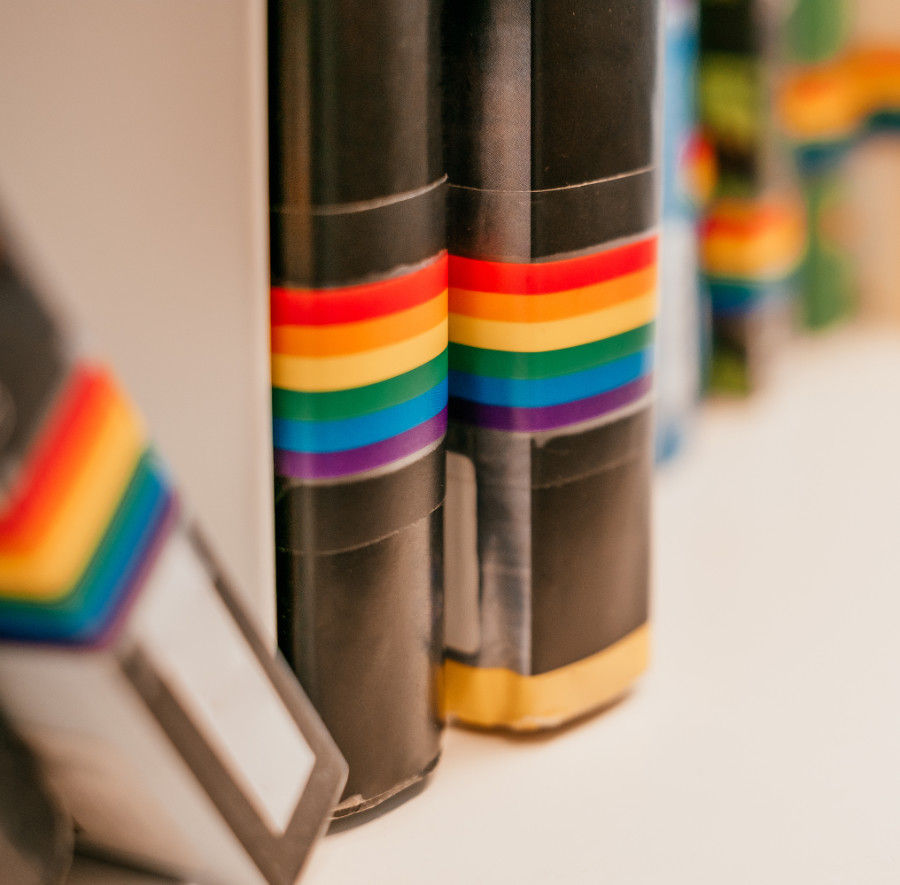 books with rainbow flag