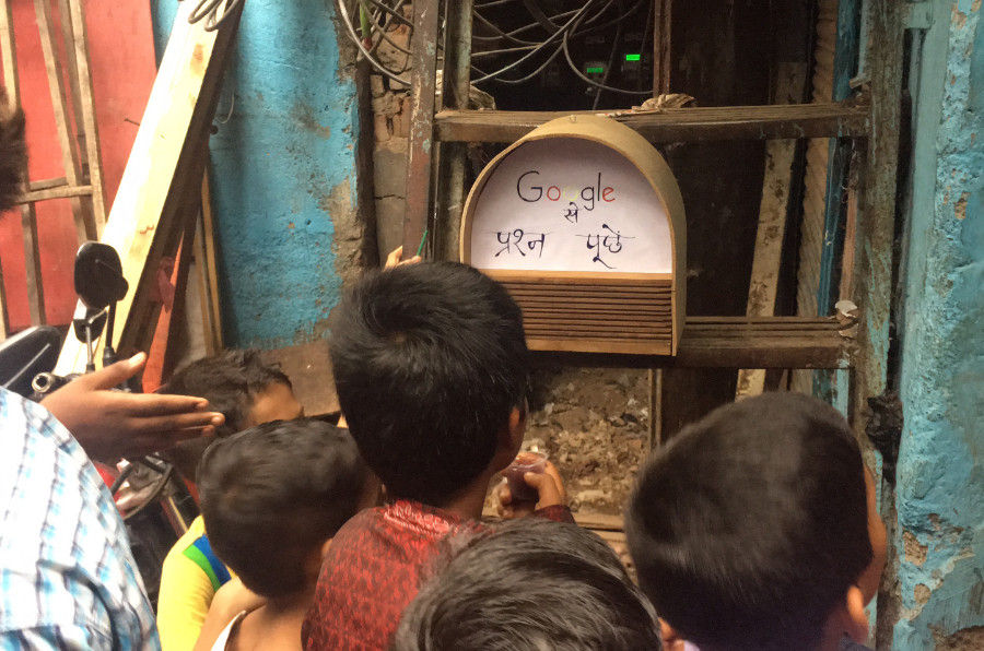 people looking at a device