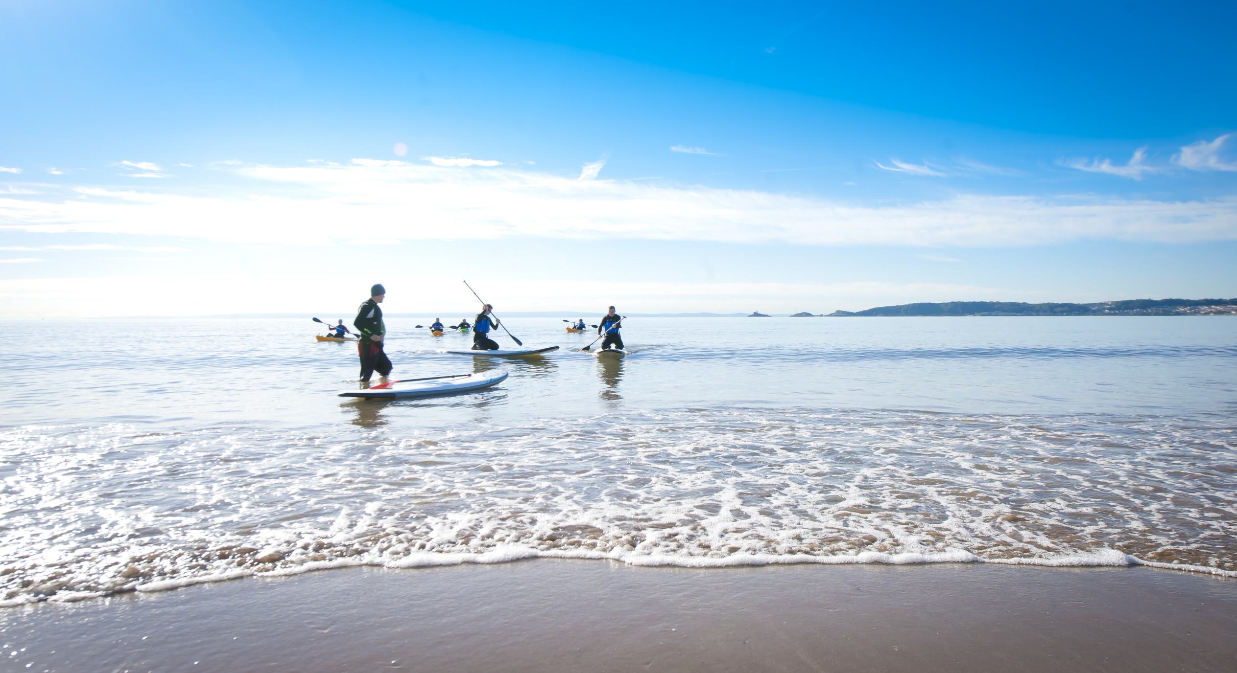 people on paddleboards