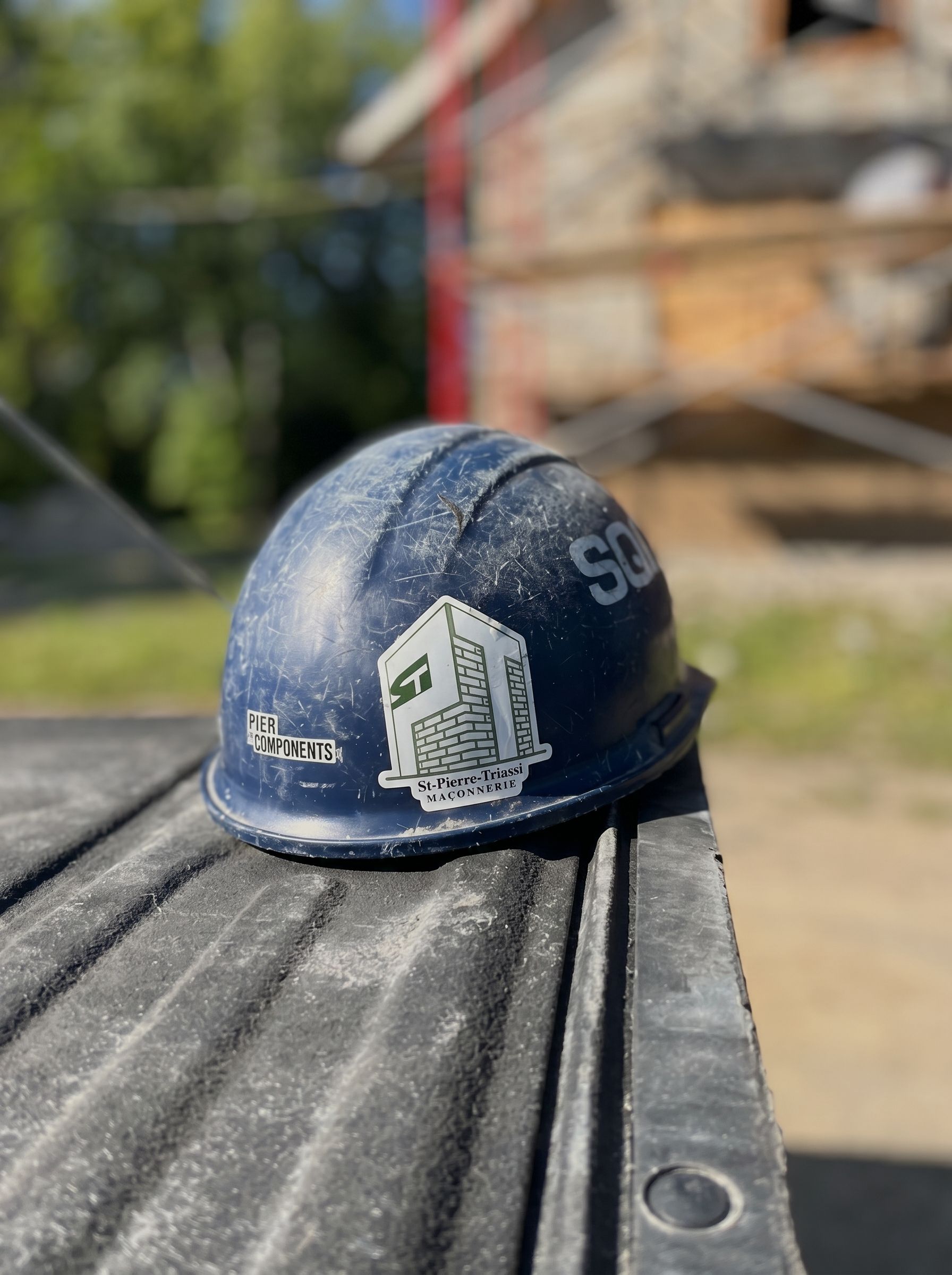 St-Pierre Triassi company helmet on a work site