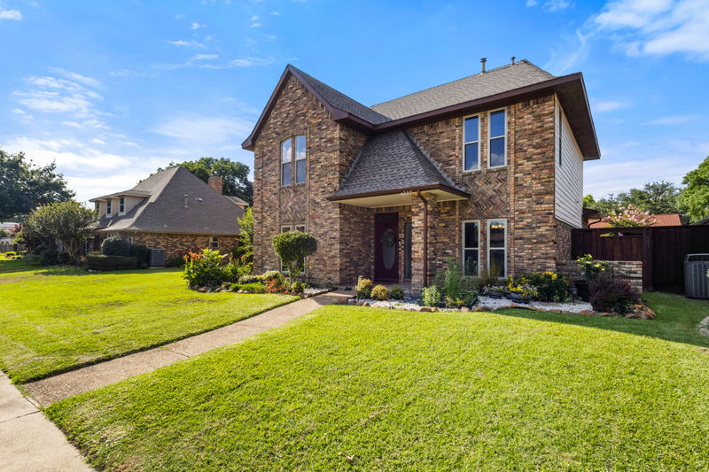 4227 Country Brook Dr - Kitchen — sink wall with granite counters and travertine backsplash