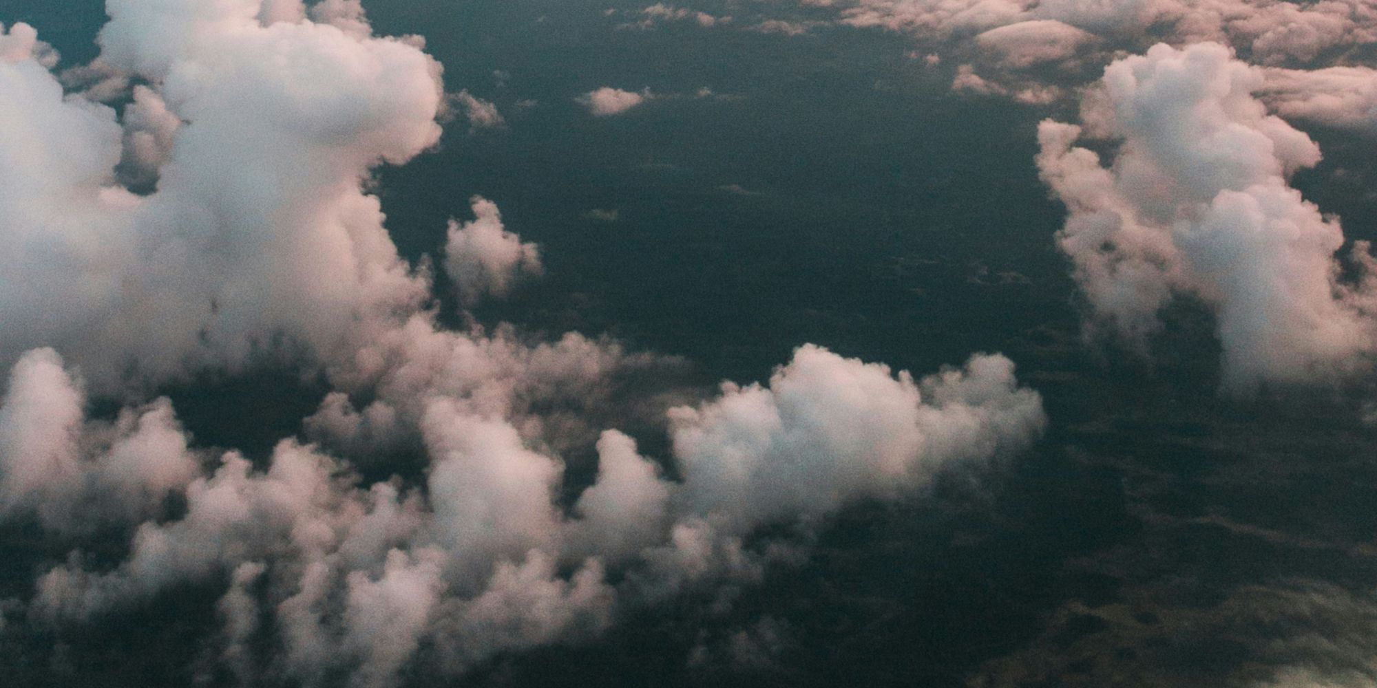 An aerial view of a cloudy sky at sunset