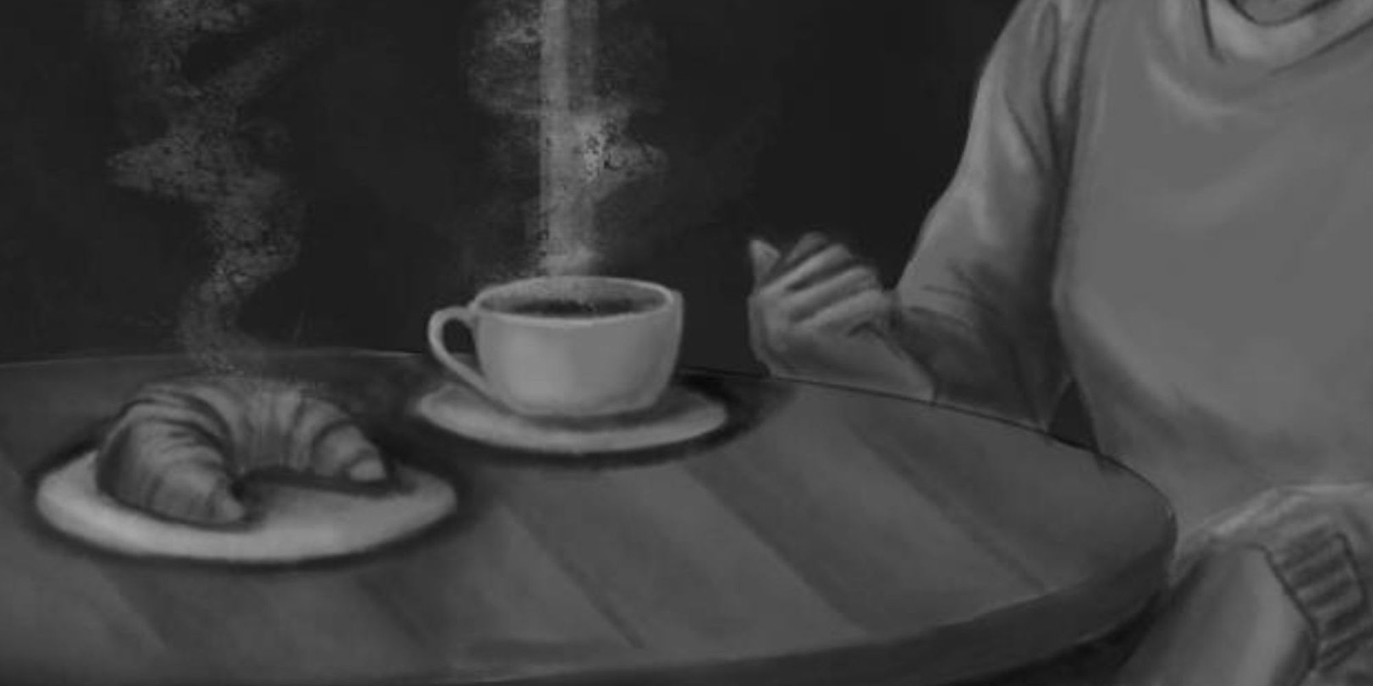 A woman sitting at a table with a cup of coffee and a croissant