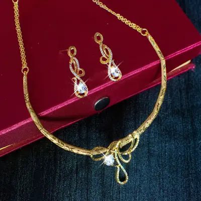 Gold-Toned Forming Collar Necklace Set with Teardrop AD Pendant