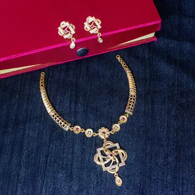 Gold-Toned Forming Collar Necklace Set with Geometric AD & Ruby Accent Pendant