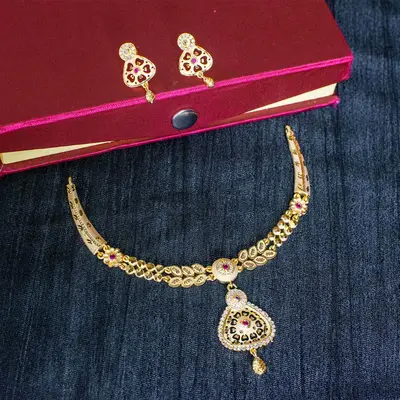Gold-Toned Forming Necklace Set with Purple Stone & AD Pendant