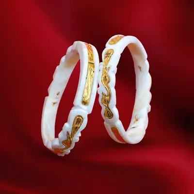 Traditional Carved Shell Bangles with Gold-Plated Peacock and Ribbon Motif