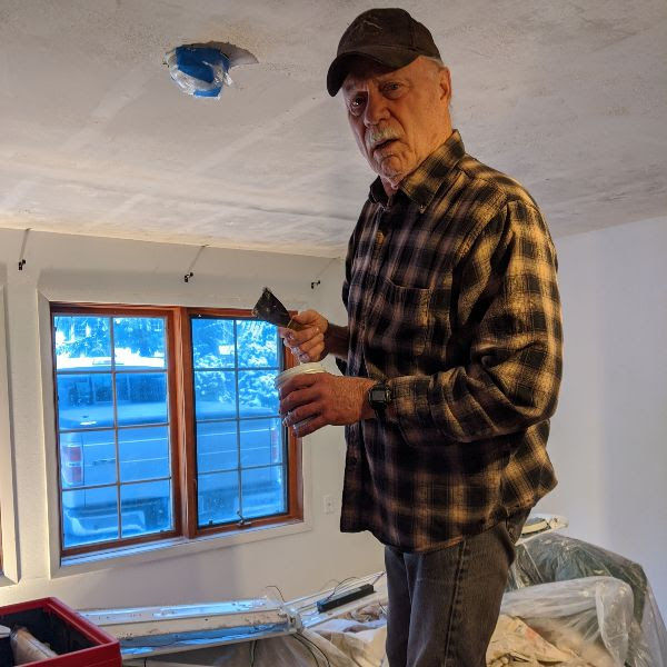 Volunteer prepping one of the rooms for guests.