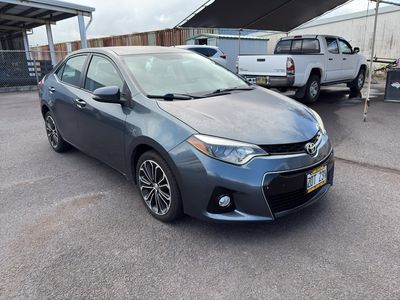 2015 Toyota Corolla — rear three-quarter view