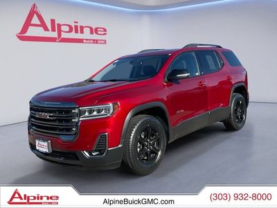 2023 GMC Acadia AT4 in Volcanic Red Tintcoat — front three-quarter view
