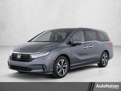 2024 Honda Odyssey Touring Auto in Modern Steel Metallic — front three-quarter view