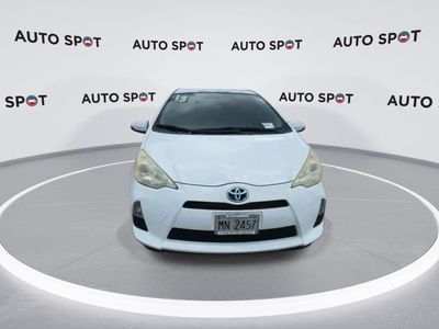 2013 Toyota Prius c — rear three-quarter view