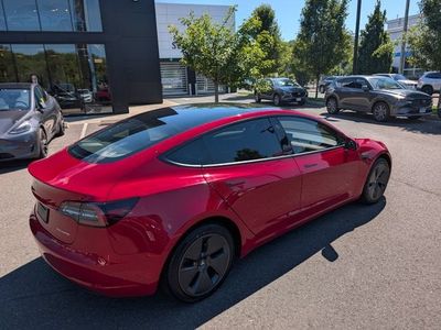 2023 Tesla Model 3 — rear three-quarter view