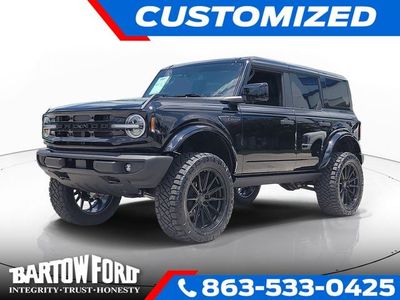 2026 Ford Bronco Outer Banks LIFTED / WHEELS AND TIRES in Shadow Black — front three-quarter view