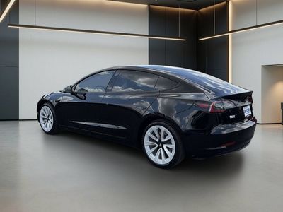 2023 Tesla Model 3 — rear three-quarter view