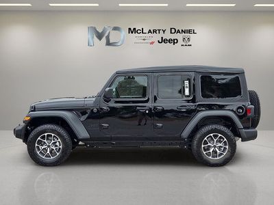 2026 Jeep Wrangler — rear three-quarter view