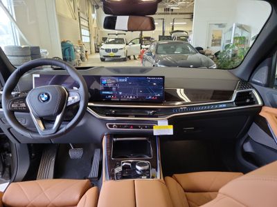 2026 BMW X5 — rear three-quarter view