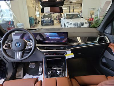 2026 BMW X5 — rear three-quarter view