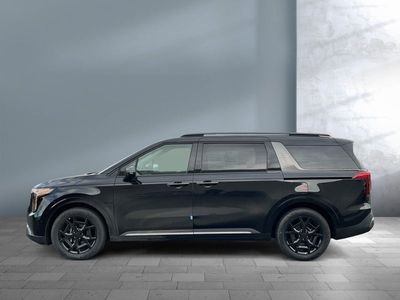 2026 Kia Carnival Hybrid — rear three-quarter view