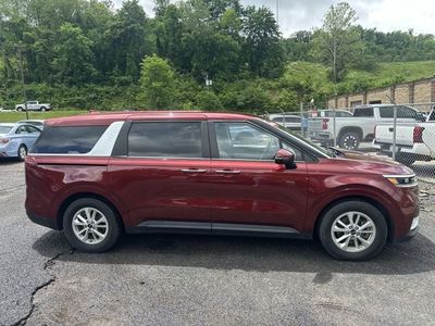 2024 Kia Carnival — rear three-quarter view