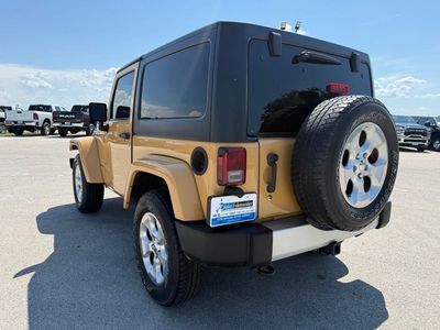 2014 Jeep Wrangler — rear three-quarter view