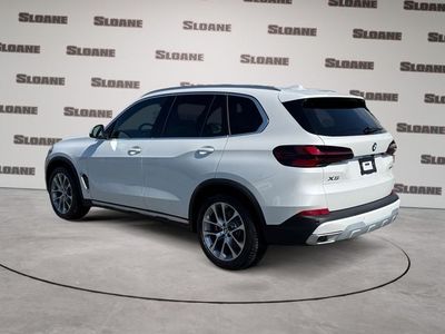 2026 BMW X5 — rear three-quarter view