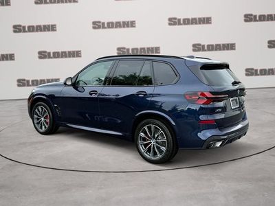 2026 BMW X5 — rear three-quarter view