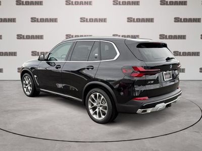 2026 BMW X5 — rear three-quarter view