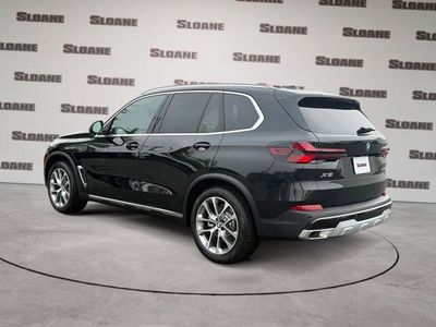 2026 BMW X5 — rear three-quarter view