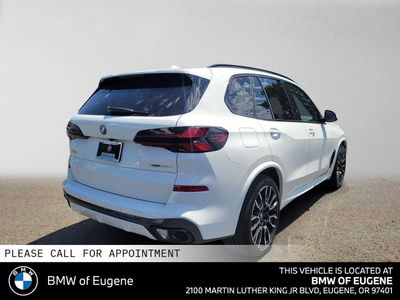 2026 BMW X5 xDrive50e — rear three-quarter view