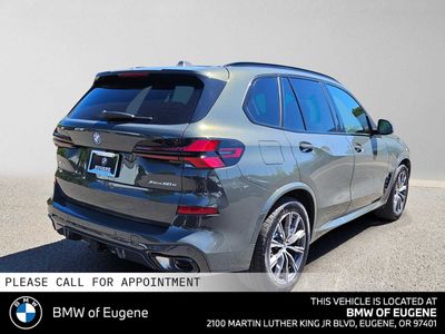 2026 BMW X5 xDrive50e — rear three-quarter view