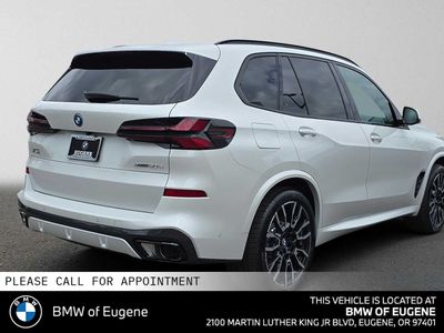 2026 BMW X5 xDrive50e — rear three-quarter view