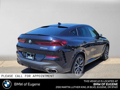2023 BMW X6 M50i — rear three-quarter view