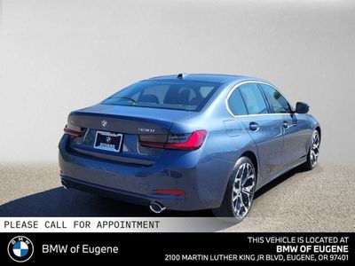 2026 BMW 330i — rear three-quarter view
