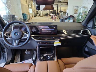 2026 BMW X5 — rear three-quarter view