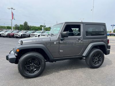 2014 Jeep Wrangler — rear three-quarter view