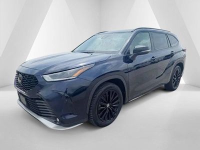 2024 Toyota Highlander — rear three-quarter view