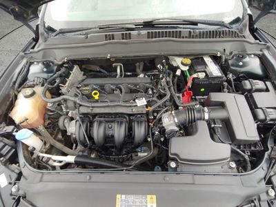 2014 Ford Fusion — rear three-quarter view