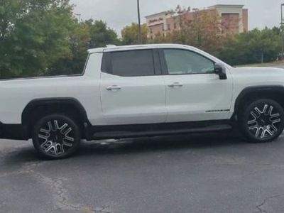 2026 GMC Sierra EV — rear three-quarter view