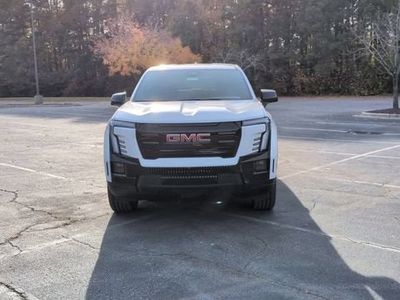 2026 GMC Sierra EV — rear three-quarter view