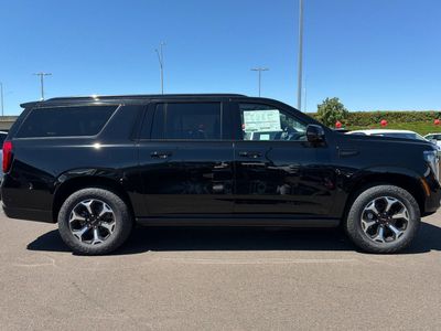 2026 GMC Yukon XL — rear three-quarter view