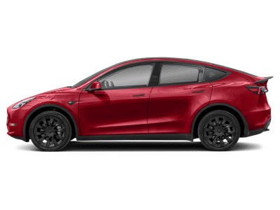 2024 Tesla Model Y — rear three-quarter view