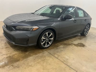 2026 Honda Civic Hatchback Hybrid — rear three-quarter view